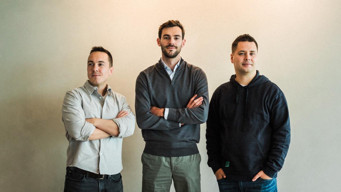 Philipp Burda (left), Mark Swan (middle), and Ivan Chalov (right) smile at the camera.