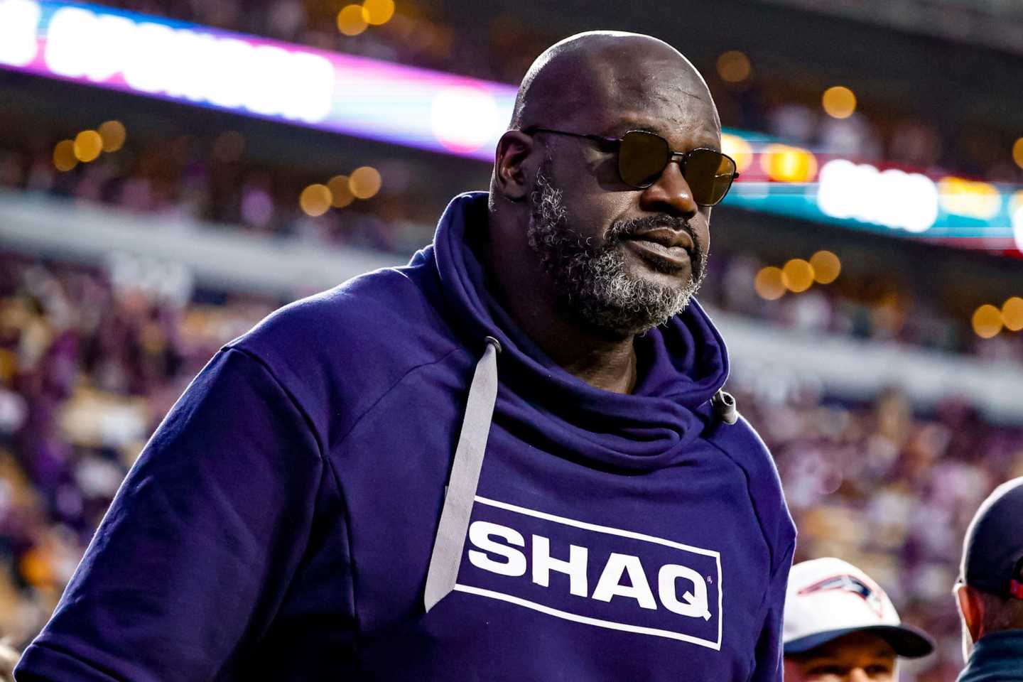 Shaquille O'Neal walks on the field before a game