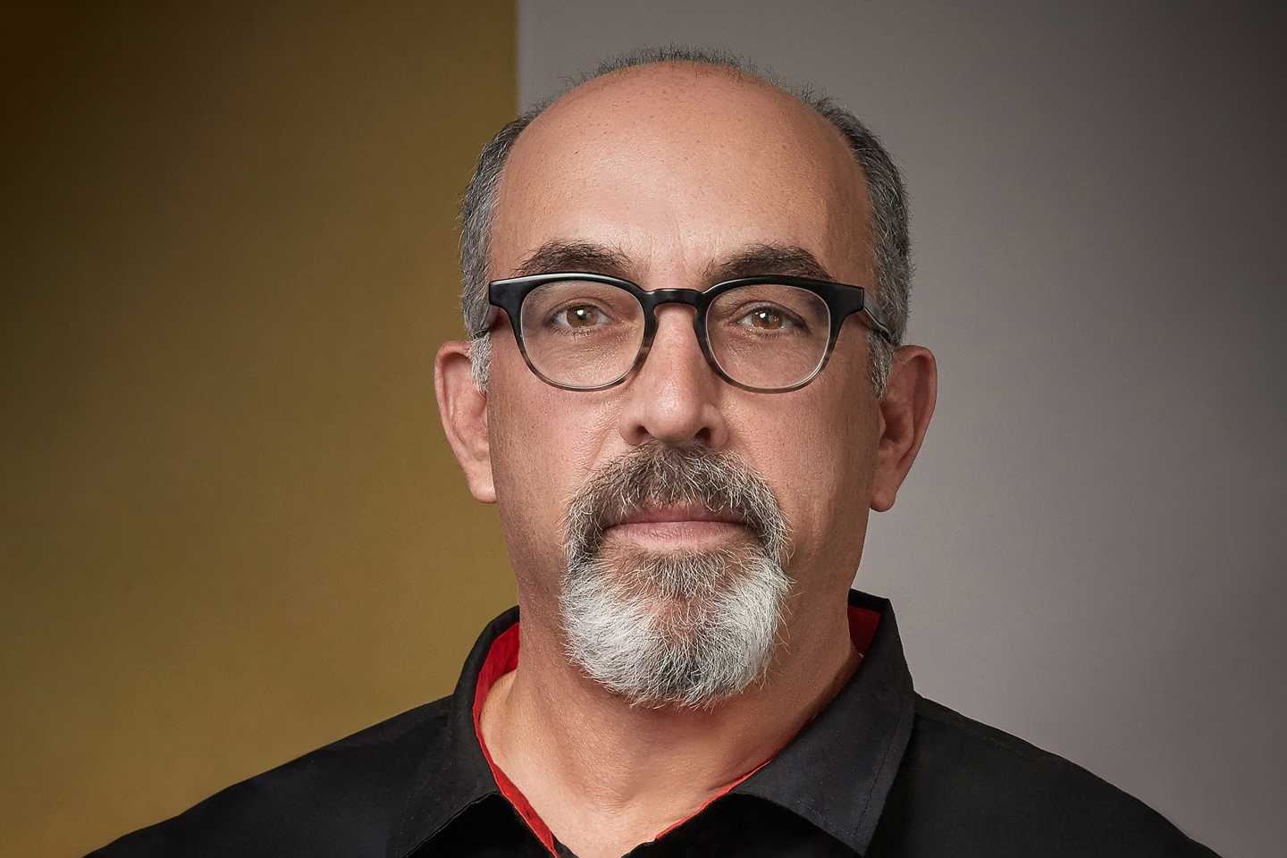 profile of a man in black button down
