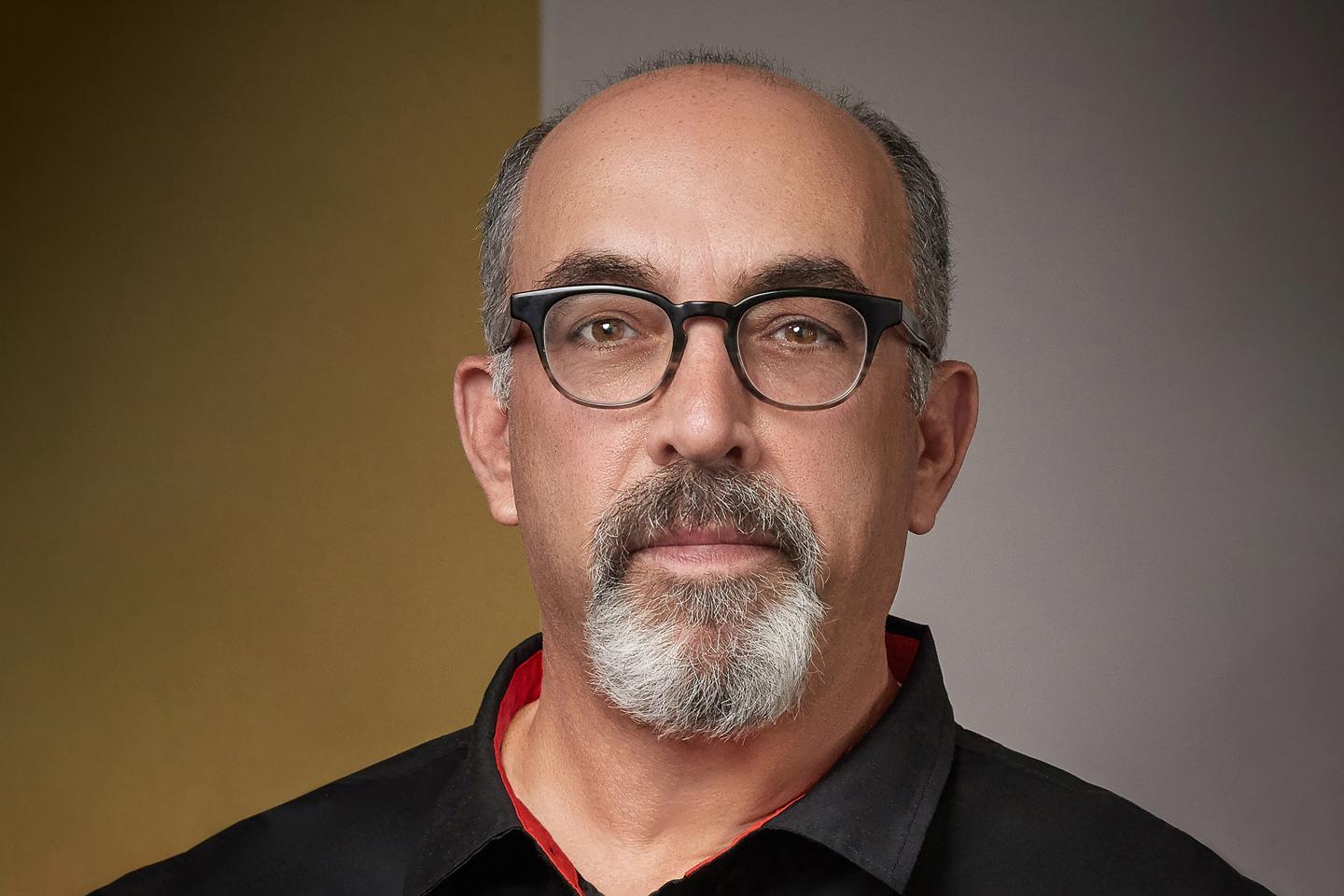 profile of a man in black button down