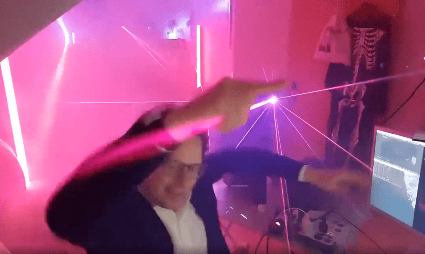 An AI-generated image of Anthropic CEO Dario Amodei dancing to electronic music.